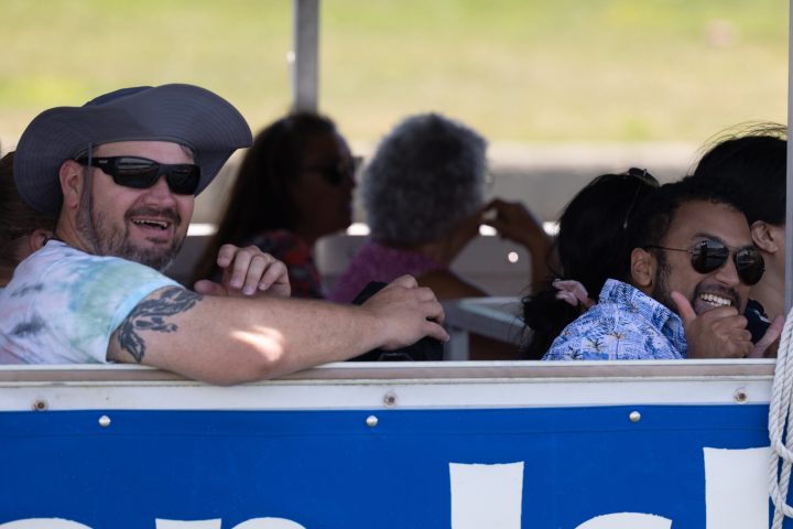 a group of people looking at a cell phone
