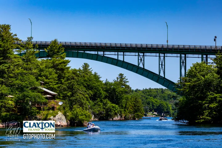 a train crossing a bridge over a body of water