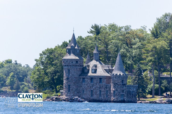 a castle surrounded by a body of water