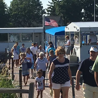 a group of people standing in front of a crowd posing for the camera