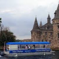 a boat traveling along a river next to a body of water