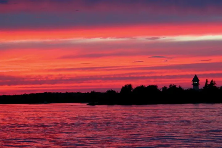 a sunset over a body of water