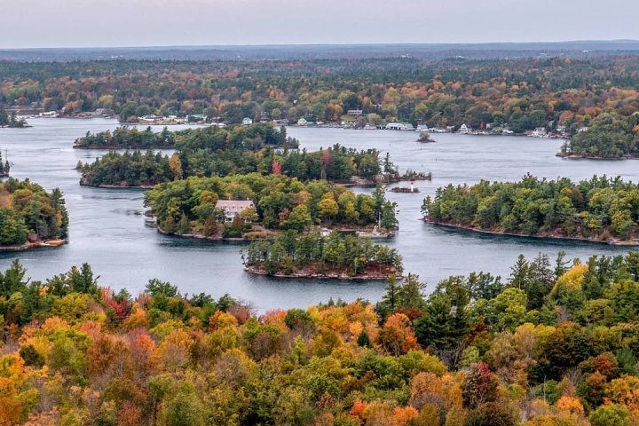 a large body of water with a city in the background