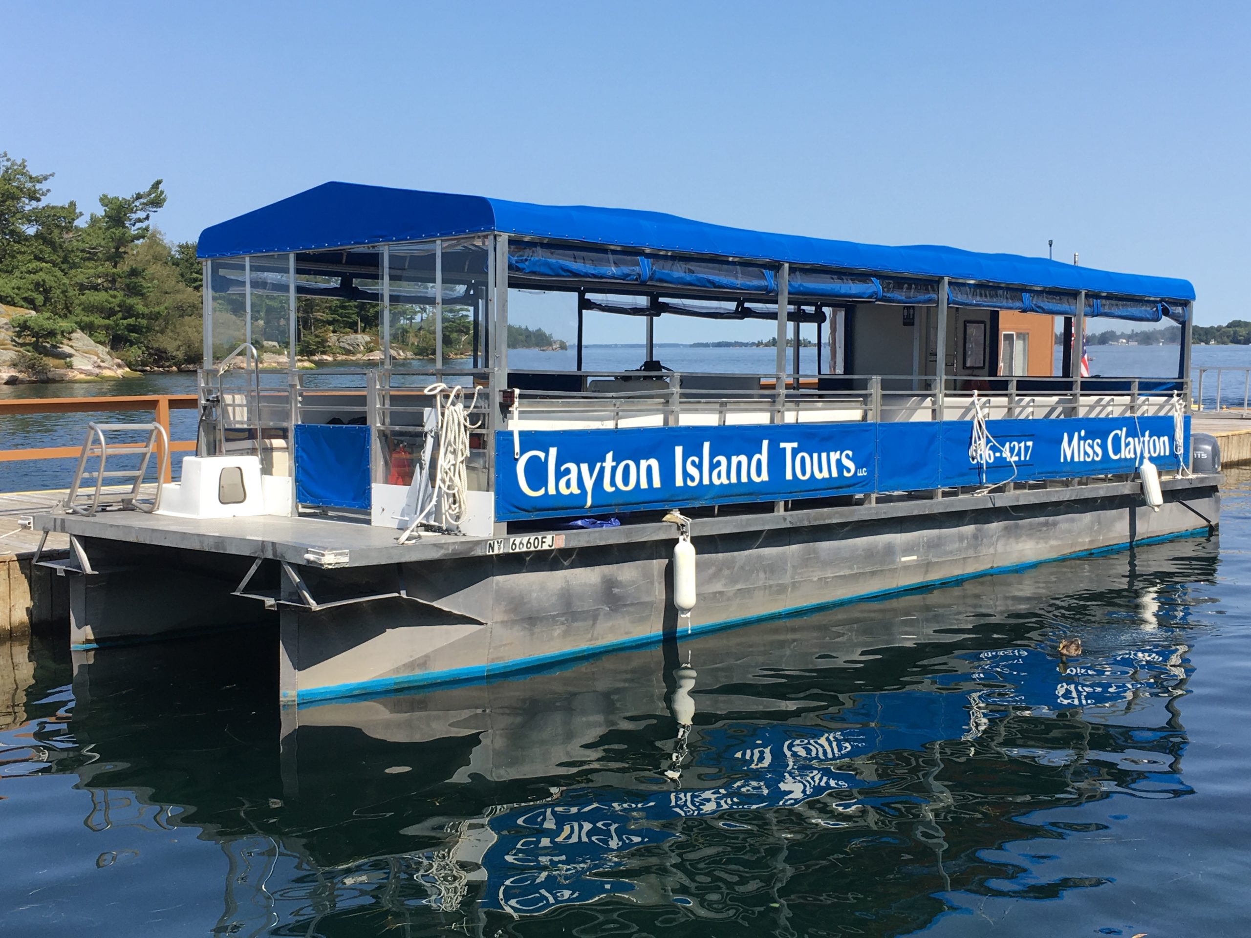 a blue boat docked in the water