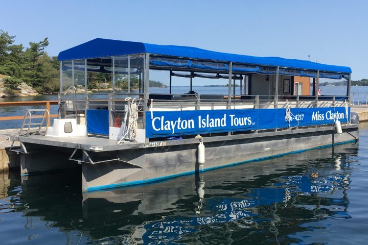 a blue boat docked in the water