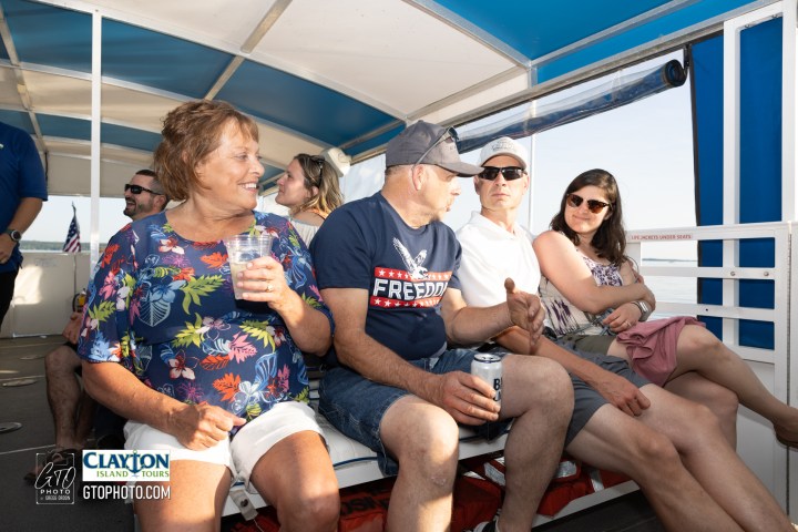 a group of people sitting on a bench