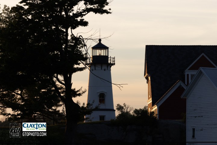 a tower that has a sign on the side of a building