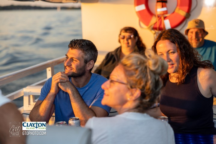 a man standing in front of water