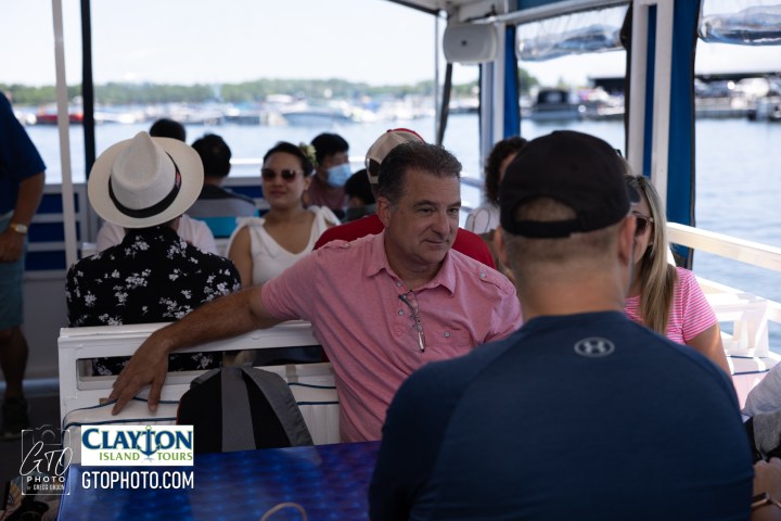 a group of people sitting on a boat
