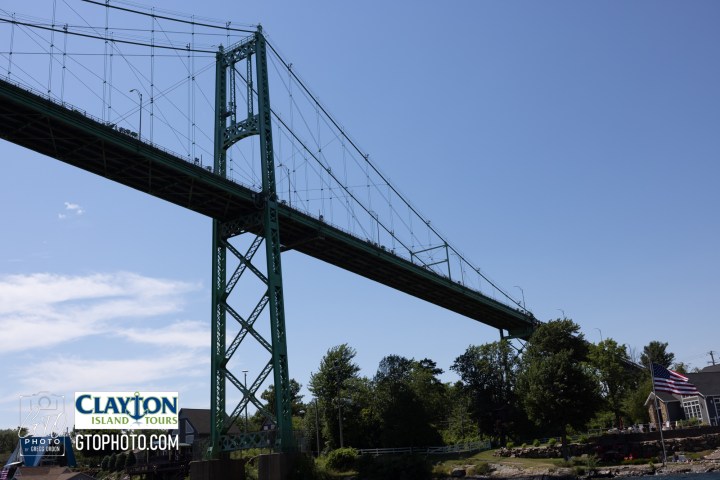 a train crossing a bridge over a river