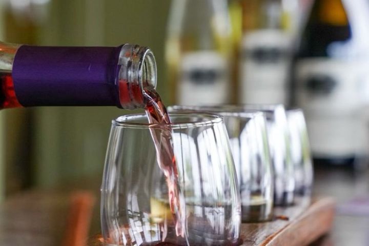 a glass of beer on a wooden table
