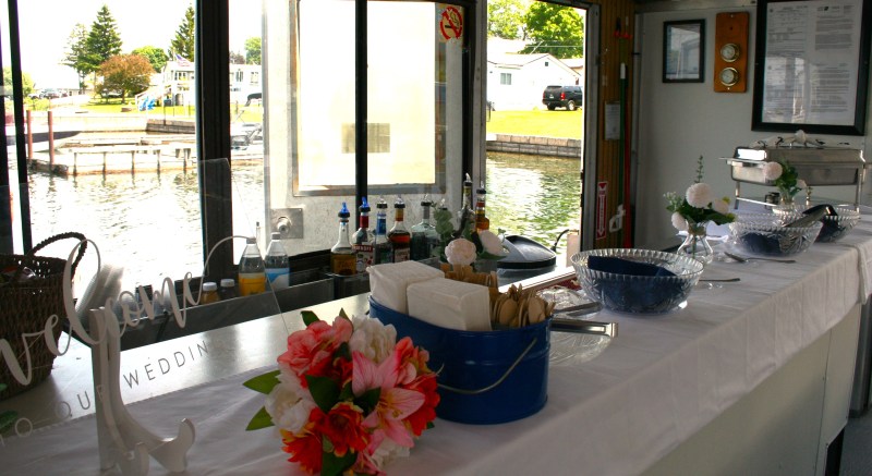 a vase of flowers on a table next to a window