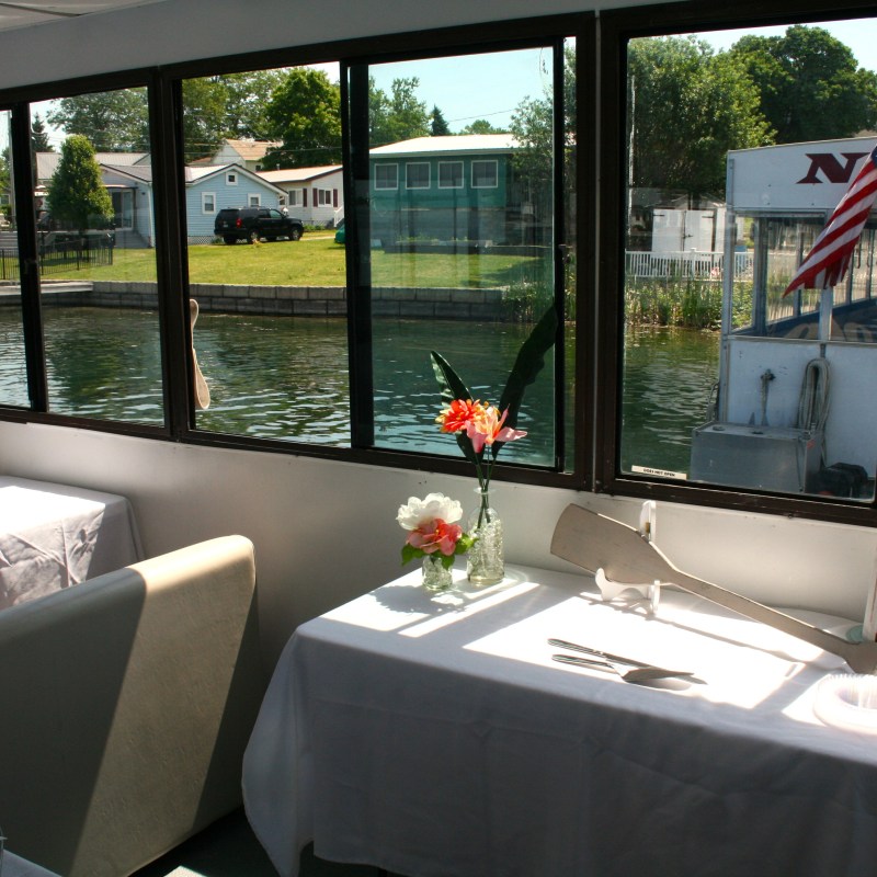 a living area with a sink and a window