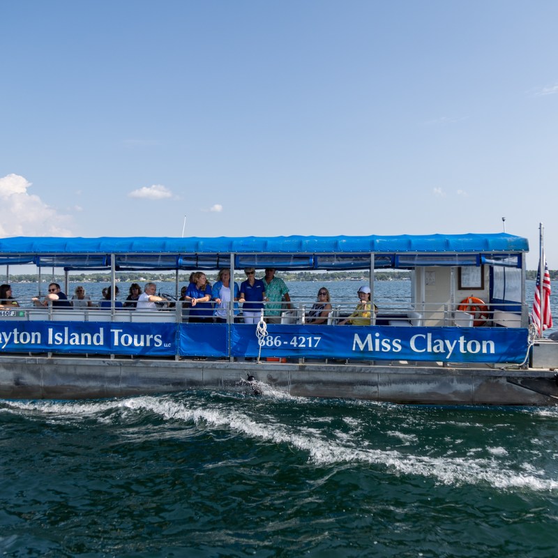 a blue boat on a body of water