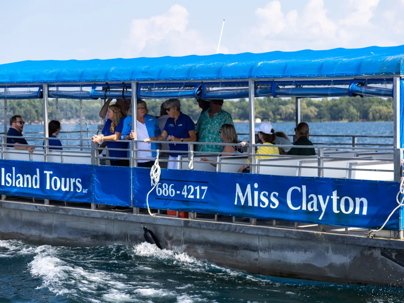 a group of people riding on the back of a boat