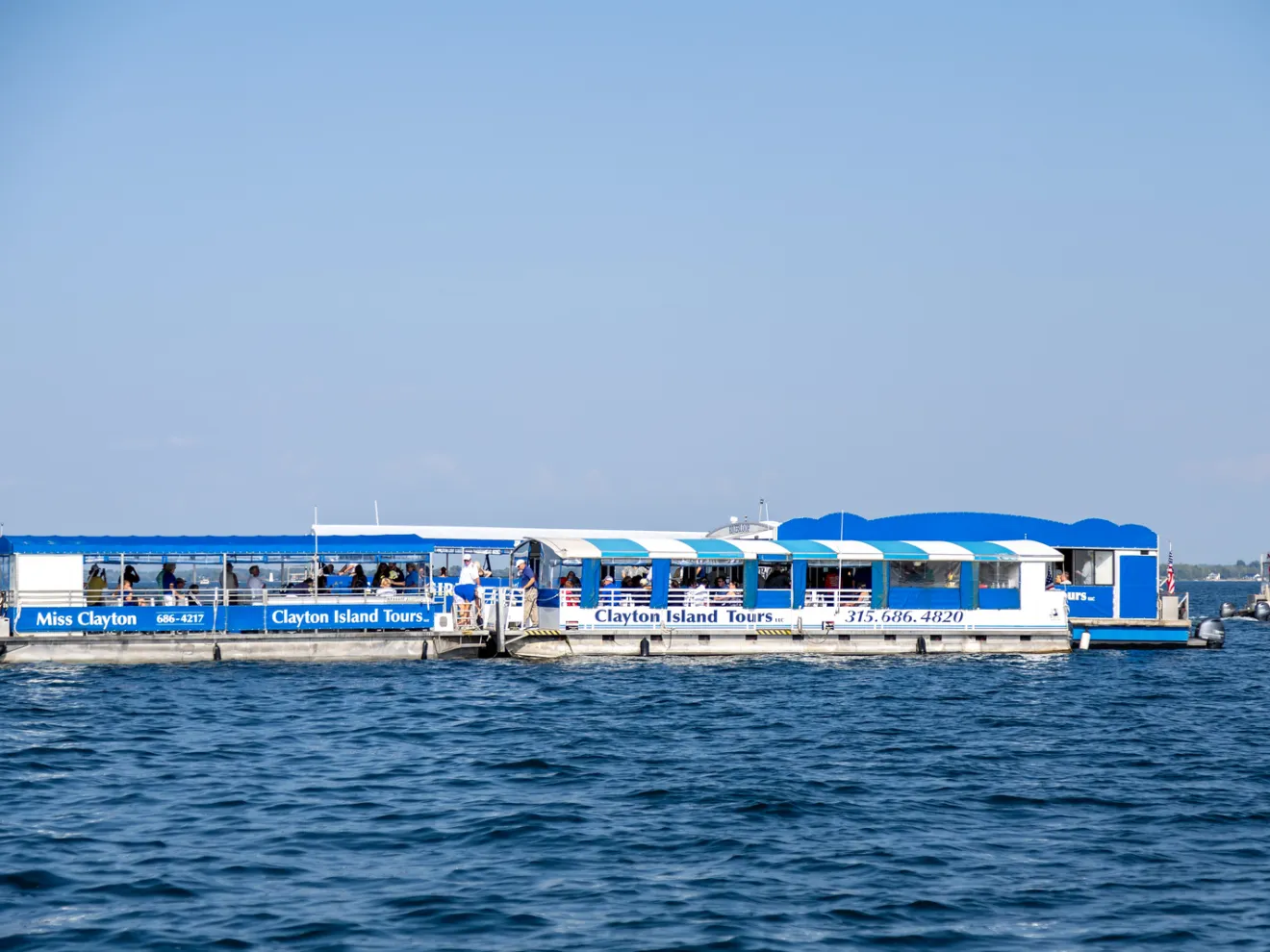 a blue boat on a body of water