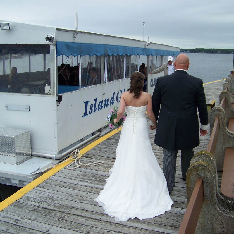 a person standing next to a boat